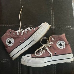 selling these purpleish colored Converse.